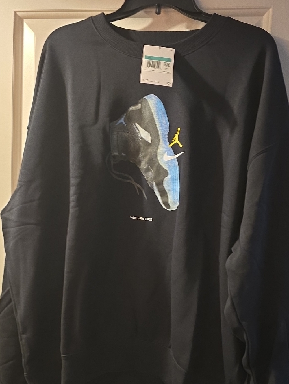 Nike Black Sweatshirt with Blue and Yellow Graphic